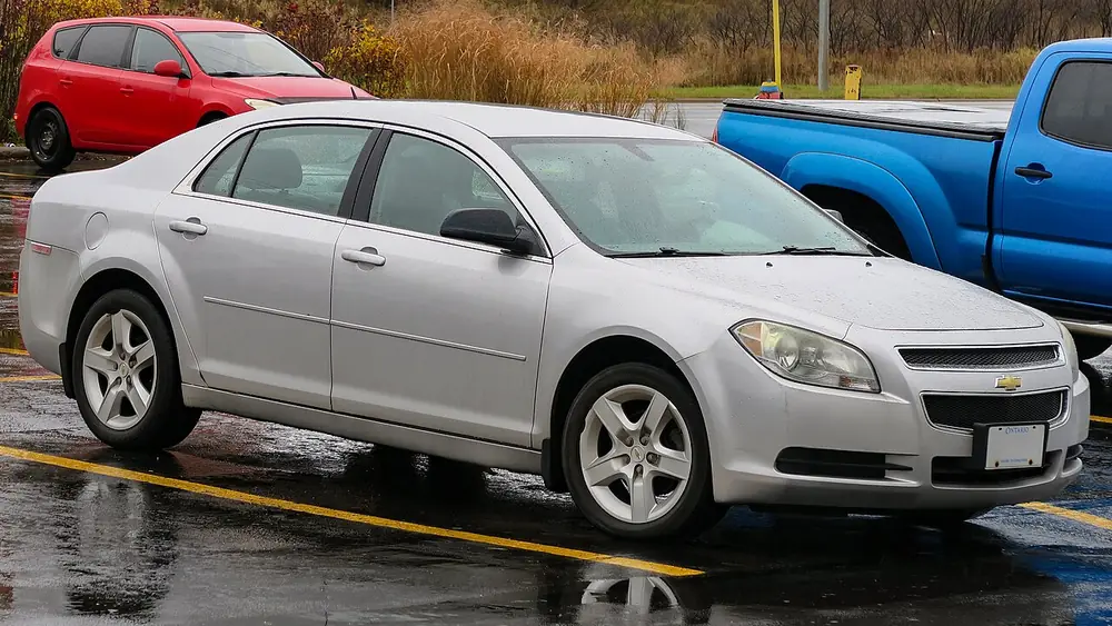 A silver 2010 Chevrolet Malibu seen from the front