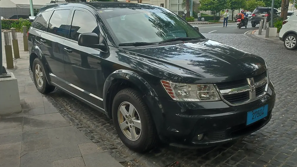 A dark 2010 Dodge Journey seen from the front