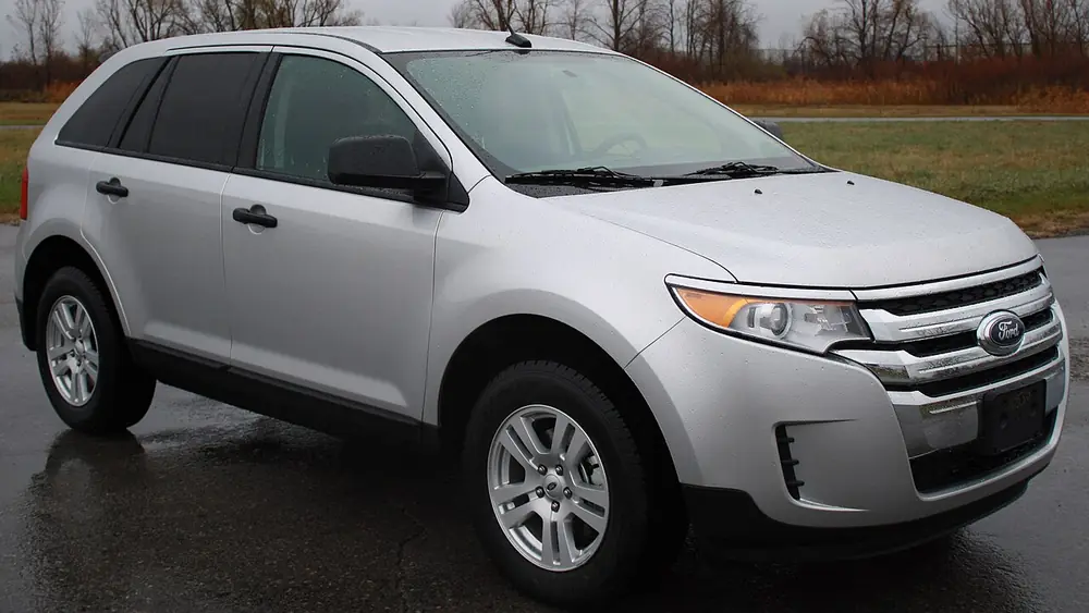 A silver 2011 Ford Edge seen from the front