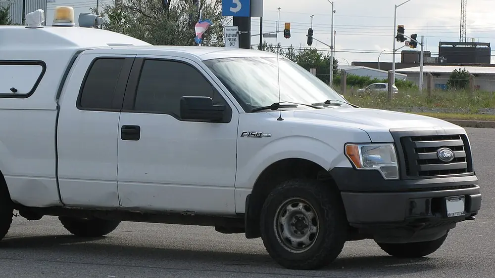 A white 2011 Ford F-150 seen from the front