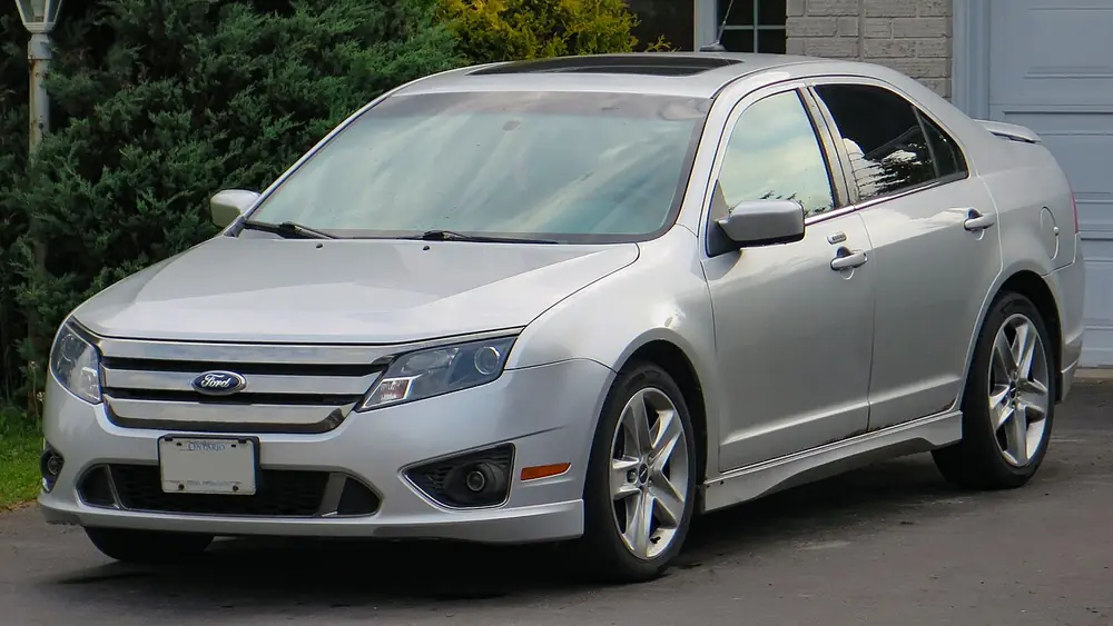 A silver 2011 Ford Fusion seen from the front