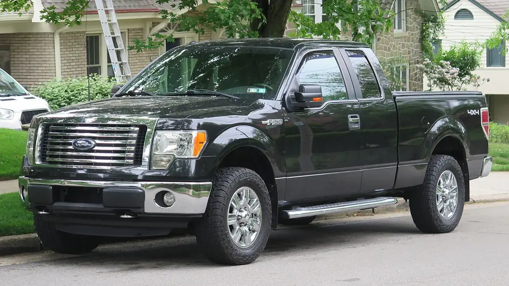 A black 2012 Ford F-150 seen from the front