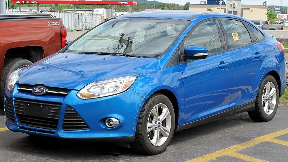A blue 2013 Ford Focus seen from the front