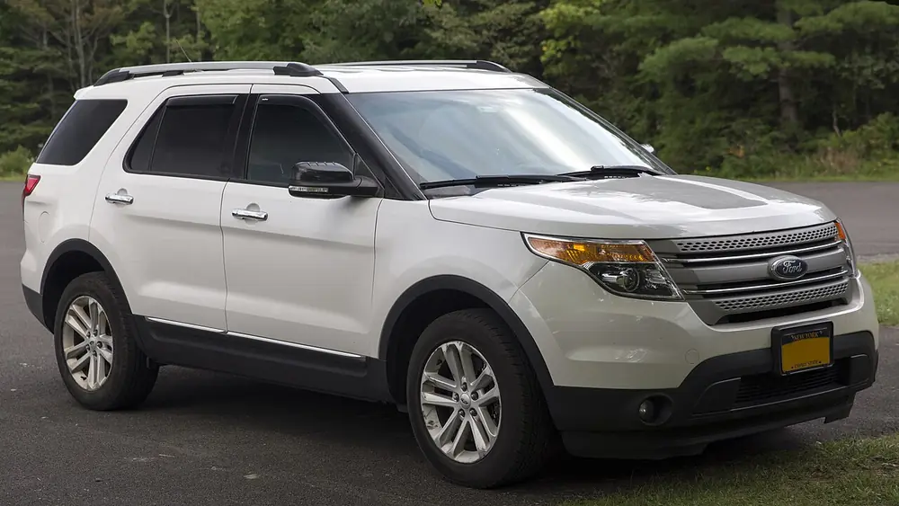 A white 2015 Ford Explorer seen from the front