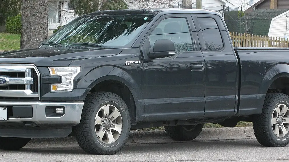 A dark 2015 Ford F-150 seen from the front