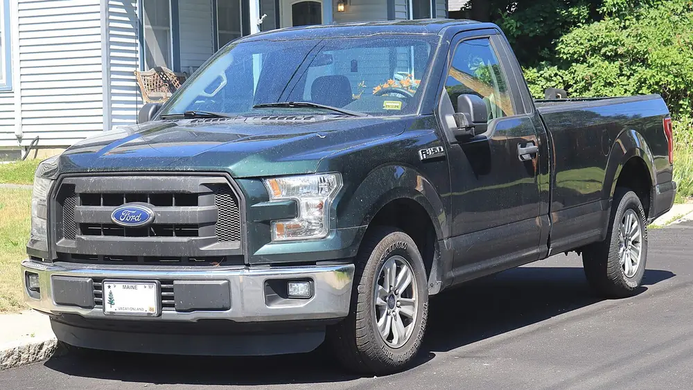 A green 2016 Ford F-150 seen from the front