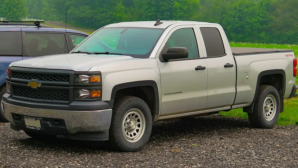 A silver 2015 Chevrolet Silverado 1500 seen from the front