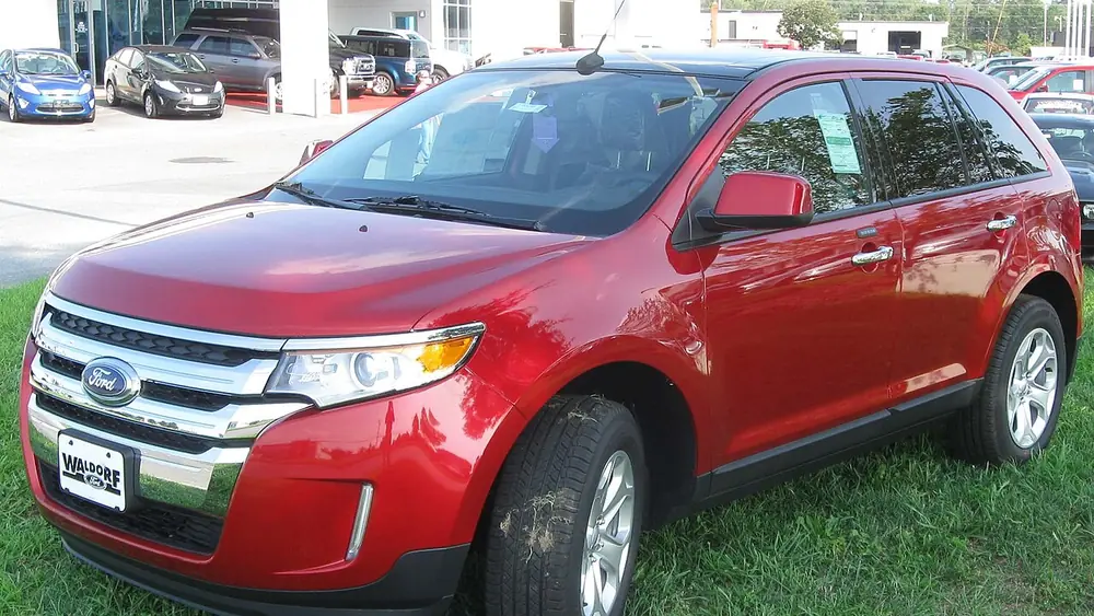 A red 2011 Ford Edge seen from the front