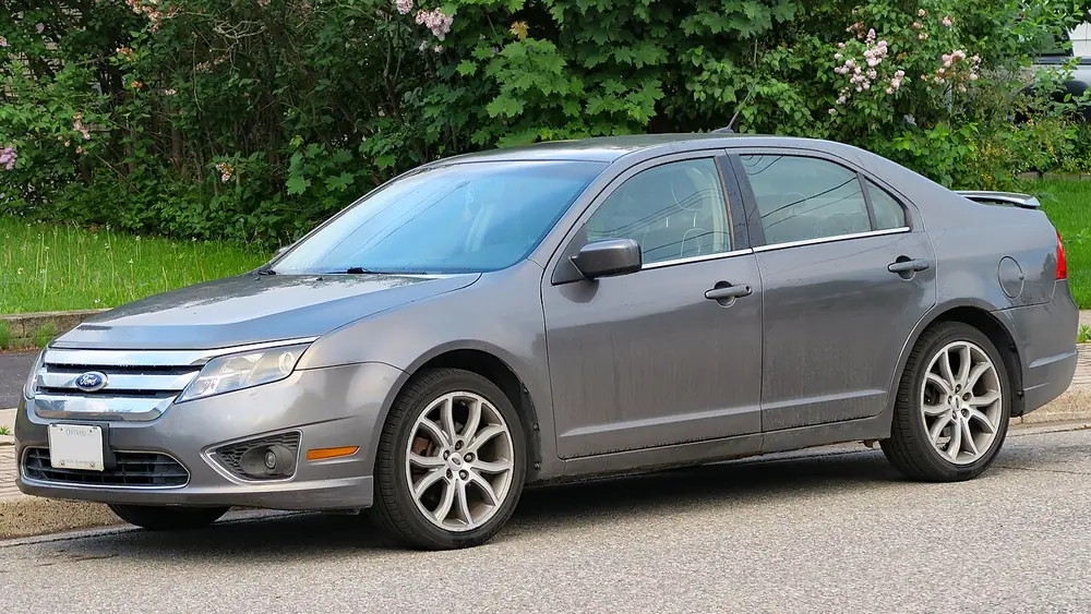 A grey 2011 Ford Fusion seen from the front