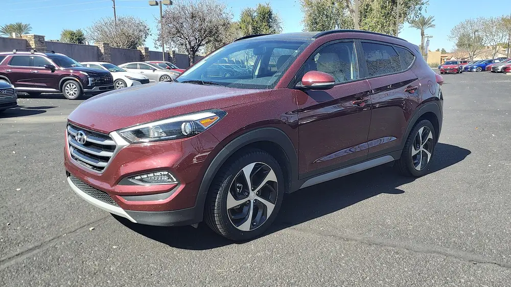A red 2017 Hyundai Tucson seen from the front