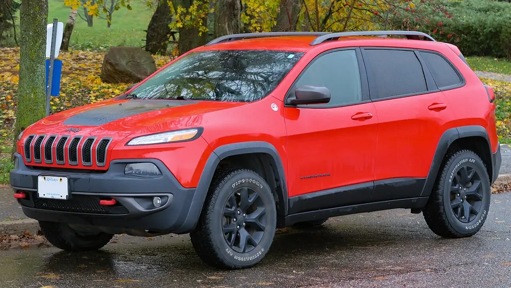 A red 2017 Jeep Cherokee seen from the front