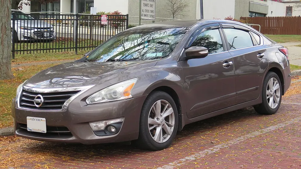 A brown 2015 Nissan Altima seen from the front