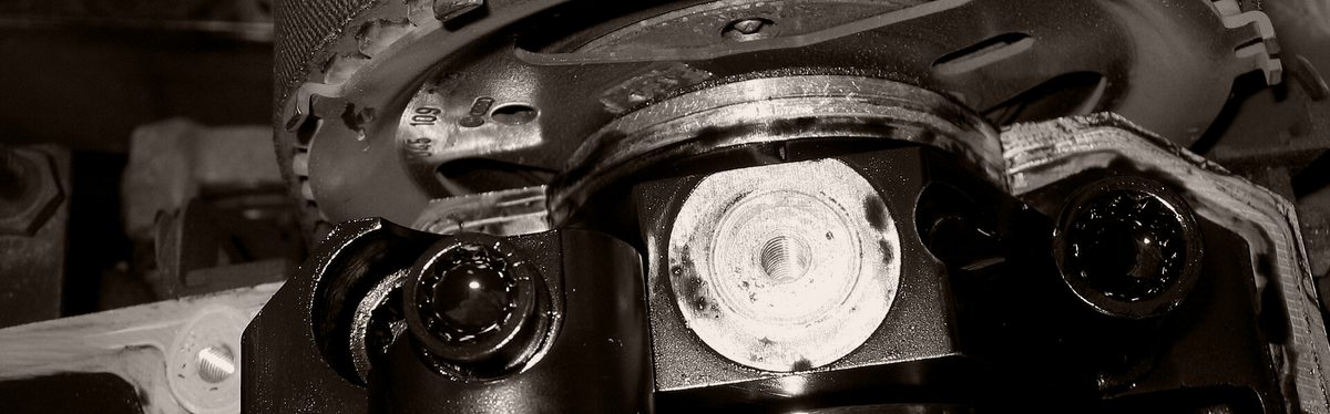 A camshaft sprocket and timing gear inside an engine's timing case