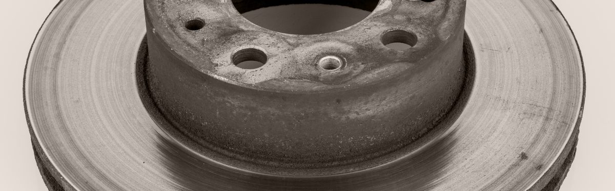 A worn brake disc removed from a vehicle