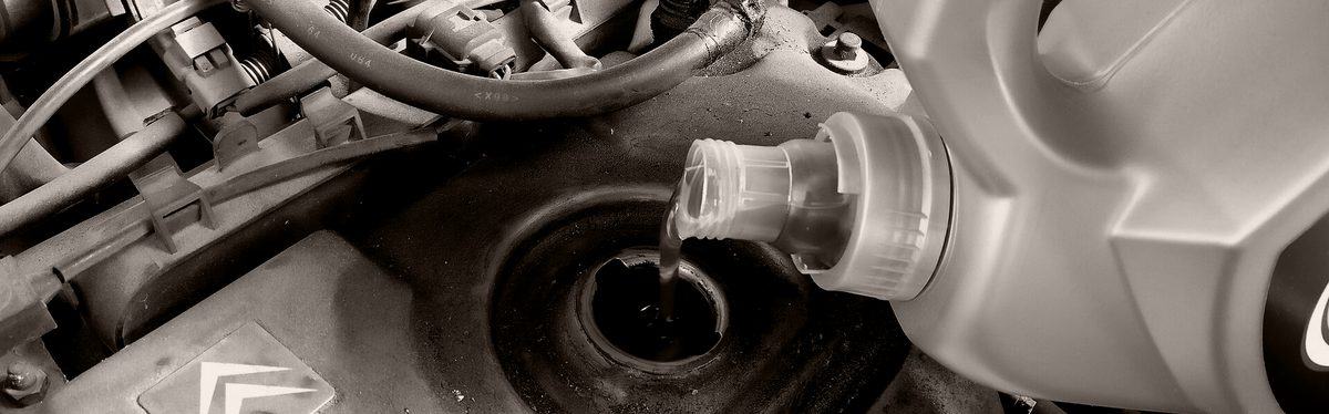 Engine oil being poured into an engine