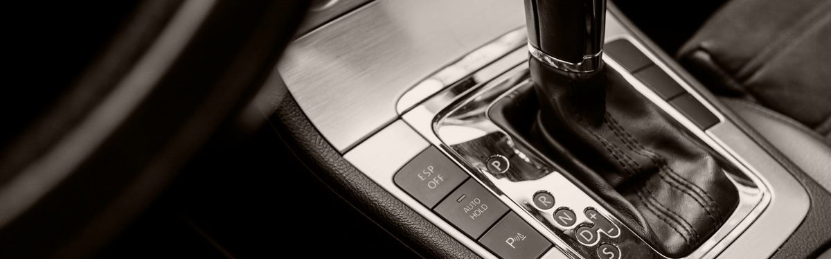 An automatic transmission oil pan with sludge deposits inside