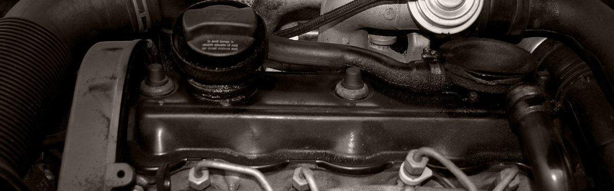 A diesel engine bay with the valve cover in view