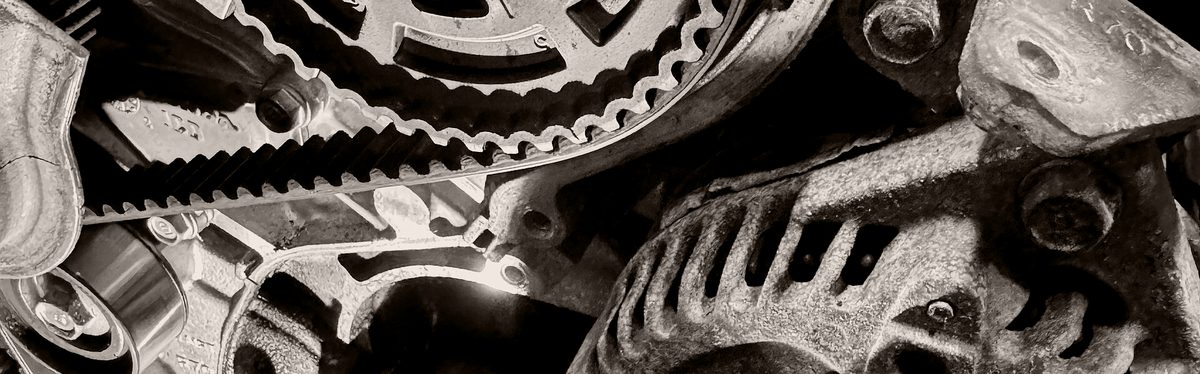 A toothed timing belt running over camshaft sprockets